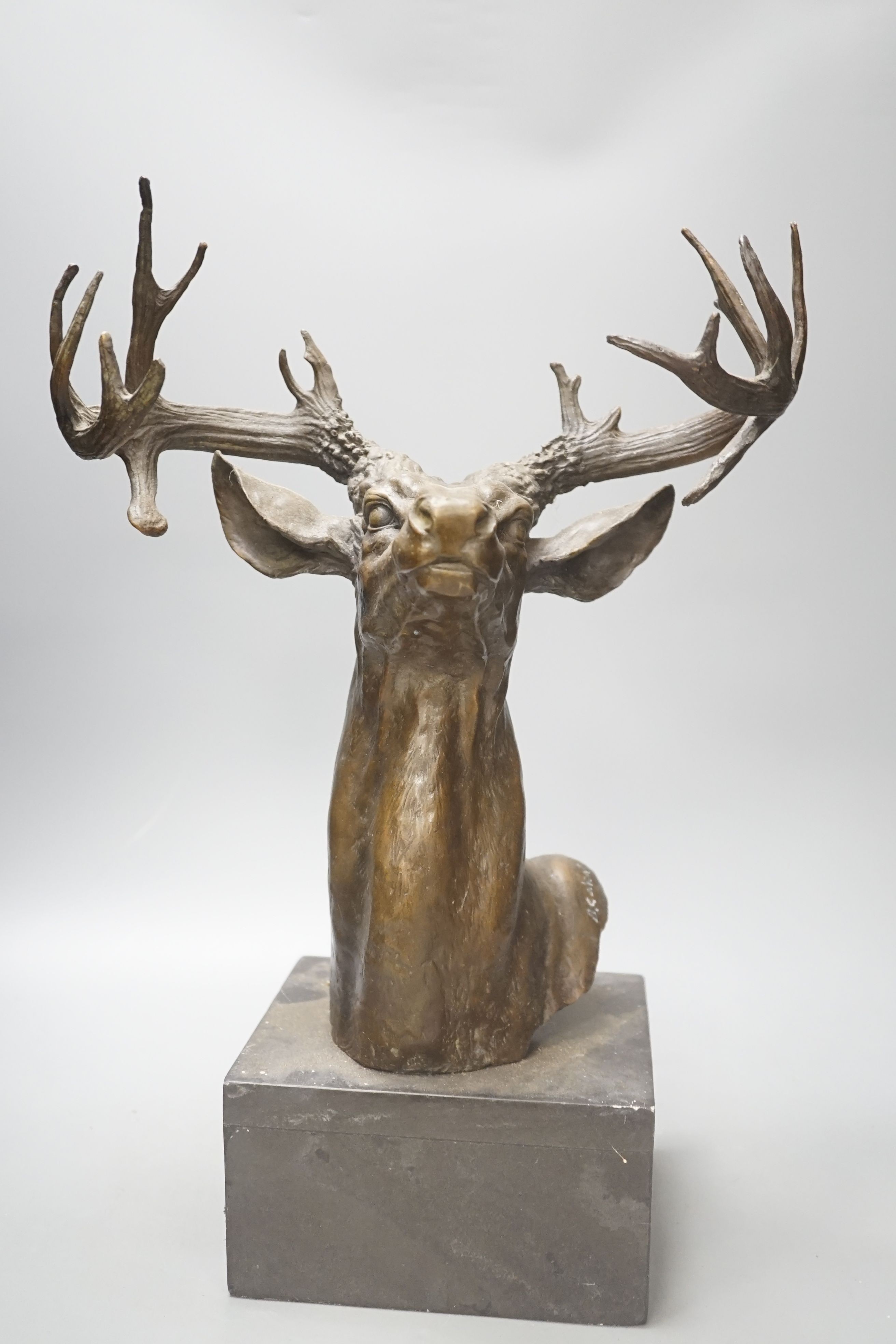 After B.C Zheng, bronzed metal model of a stag's head, 47cm